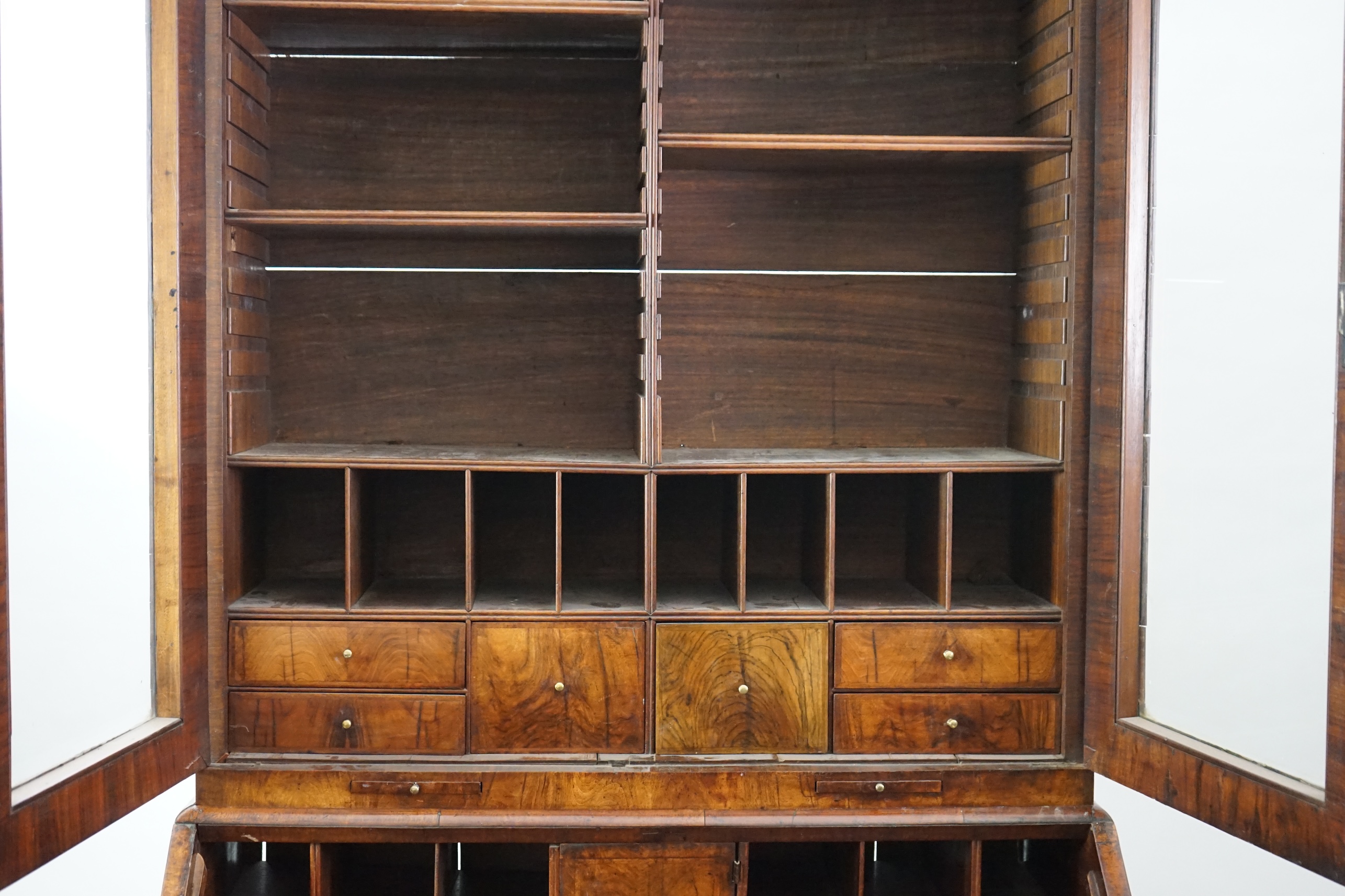 An early 18th century walnut bureau bookcase